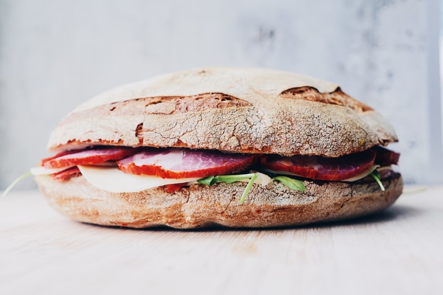 A filled roll sandwich with ham, cheese