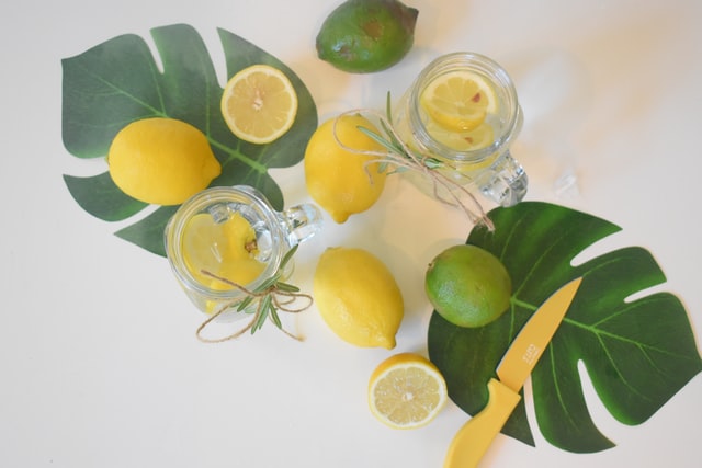 Fruit, lemons and limes, sliced in water