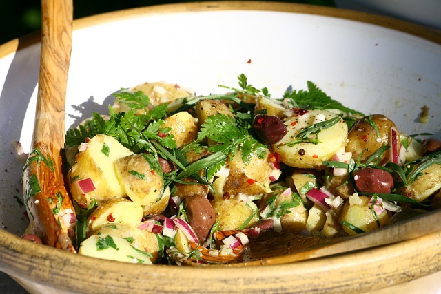 Potato salad with herbs, onions and olives