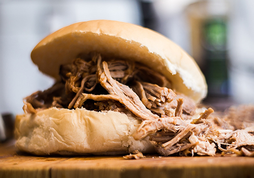 Close up of American pulled pork BBQ sandwich.