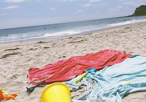 Colourful towels on the beach